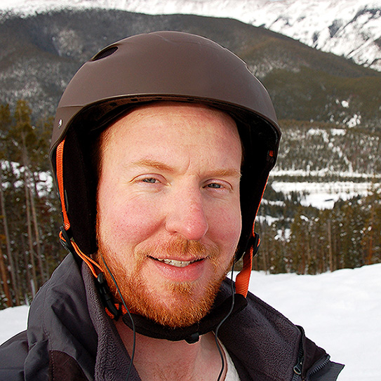man with helmet on about to ski