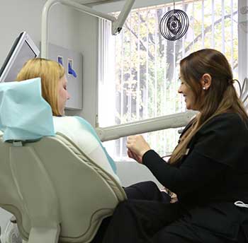Showing patient the dental inlays and onlays