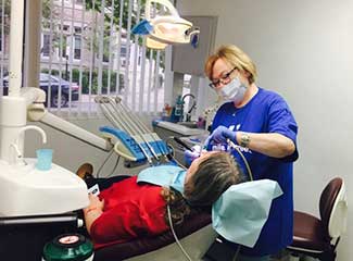 female dentist working on patient