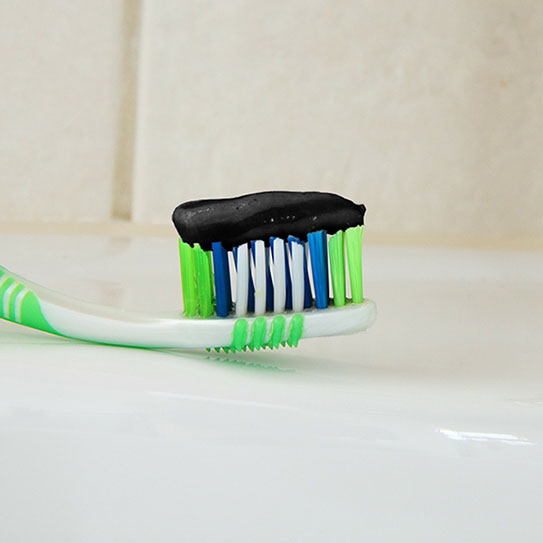 charcoal toothpaste on toothbrush