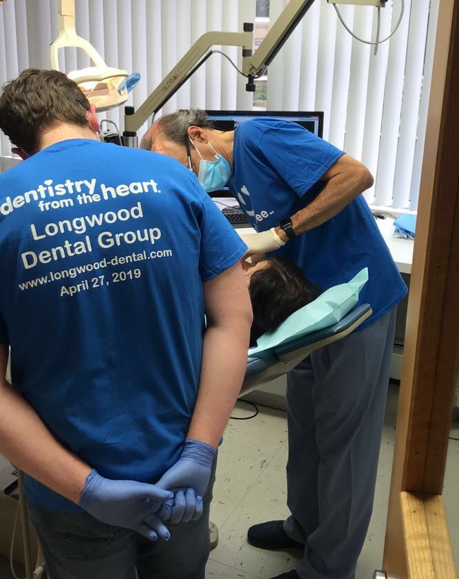 two dentists working together on patient