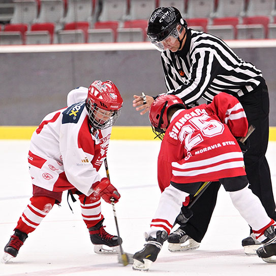 Two kids playing the game of hockey