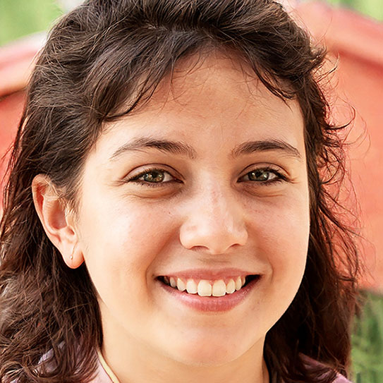 A young girl with healthy teeth smiling