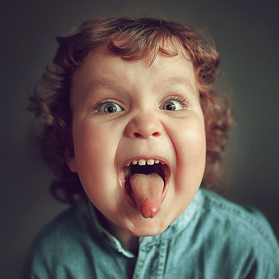 Kid sticking out his tongue