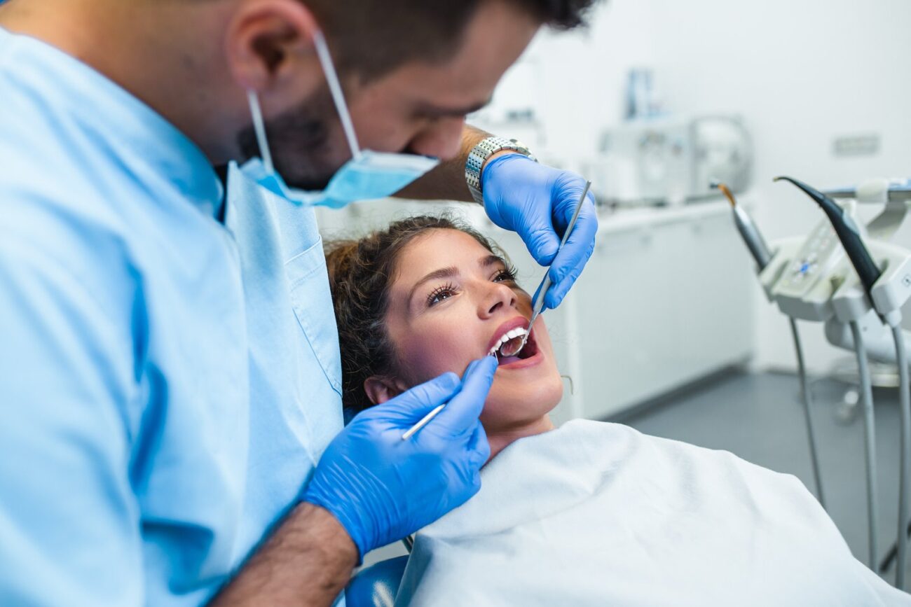 Dental patient receiving a gum health checkup at Longwood Dental Group