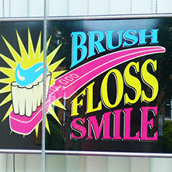 brush floss smile sign
