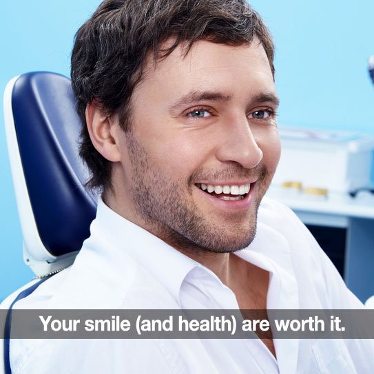 man smiling at dental office